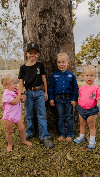 A kid wearing hat and work shirt from kids new arrival collection